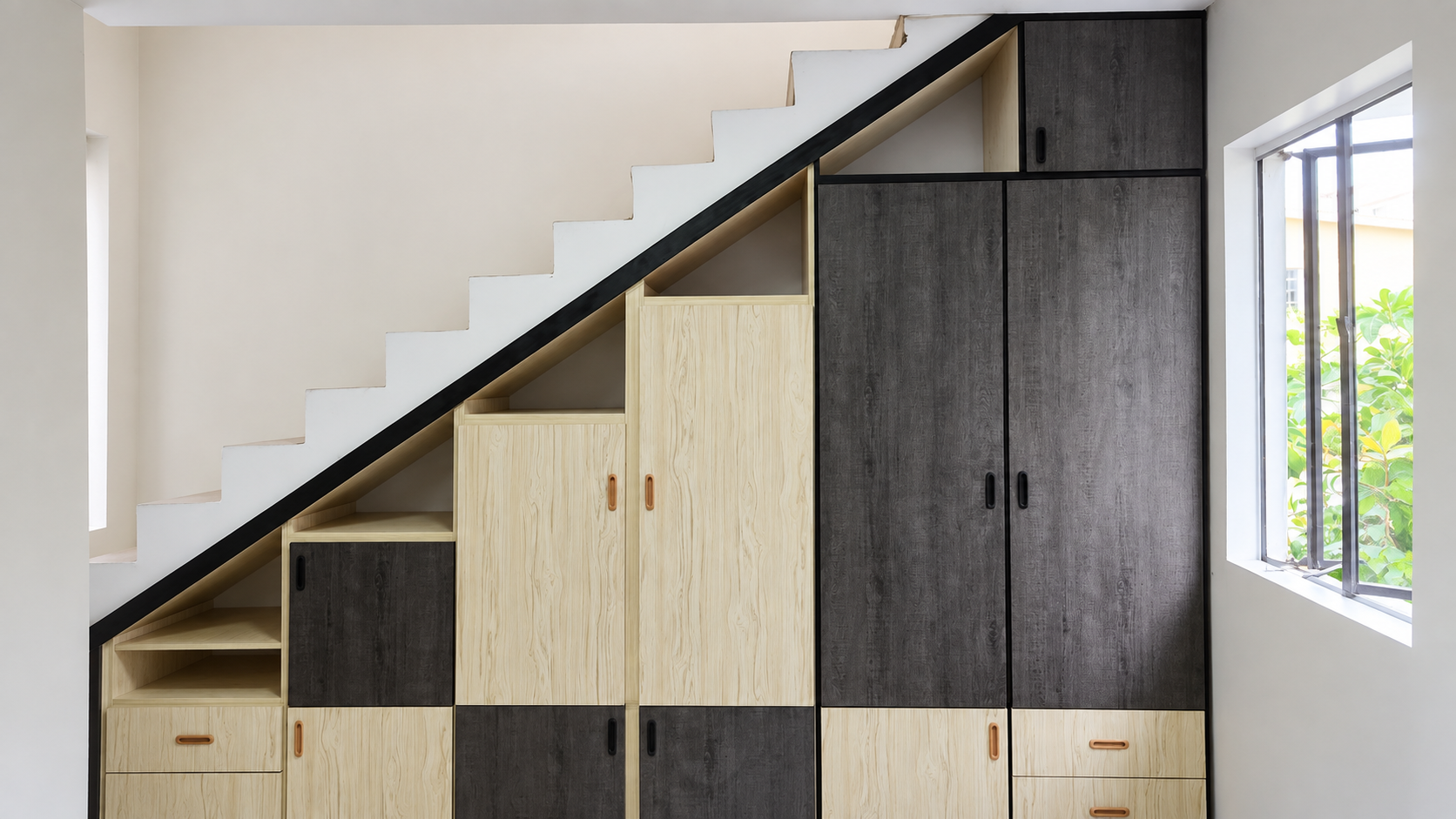 Custom storage cabinets fitted beneath a staircase